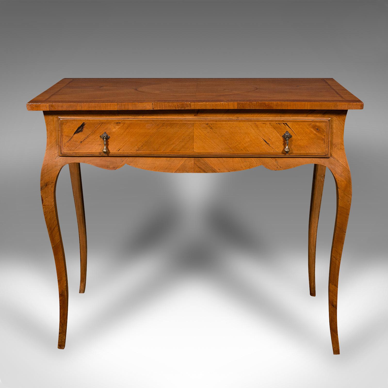 This is an antique bureau plat. A French, walnut and boxwood writing desk in Louis XV revival taste, dating to the late Victorian period, circa 1900.
 
Beautiful revival homage to the celebrated Louis XV taste
Displays a desirable aged patina and