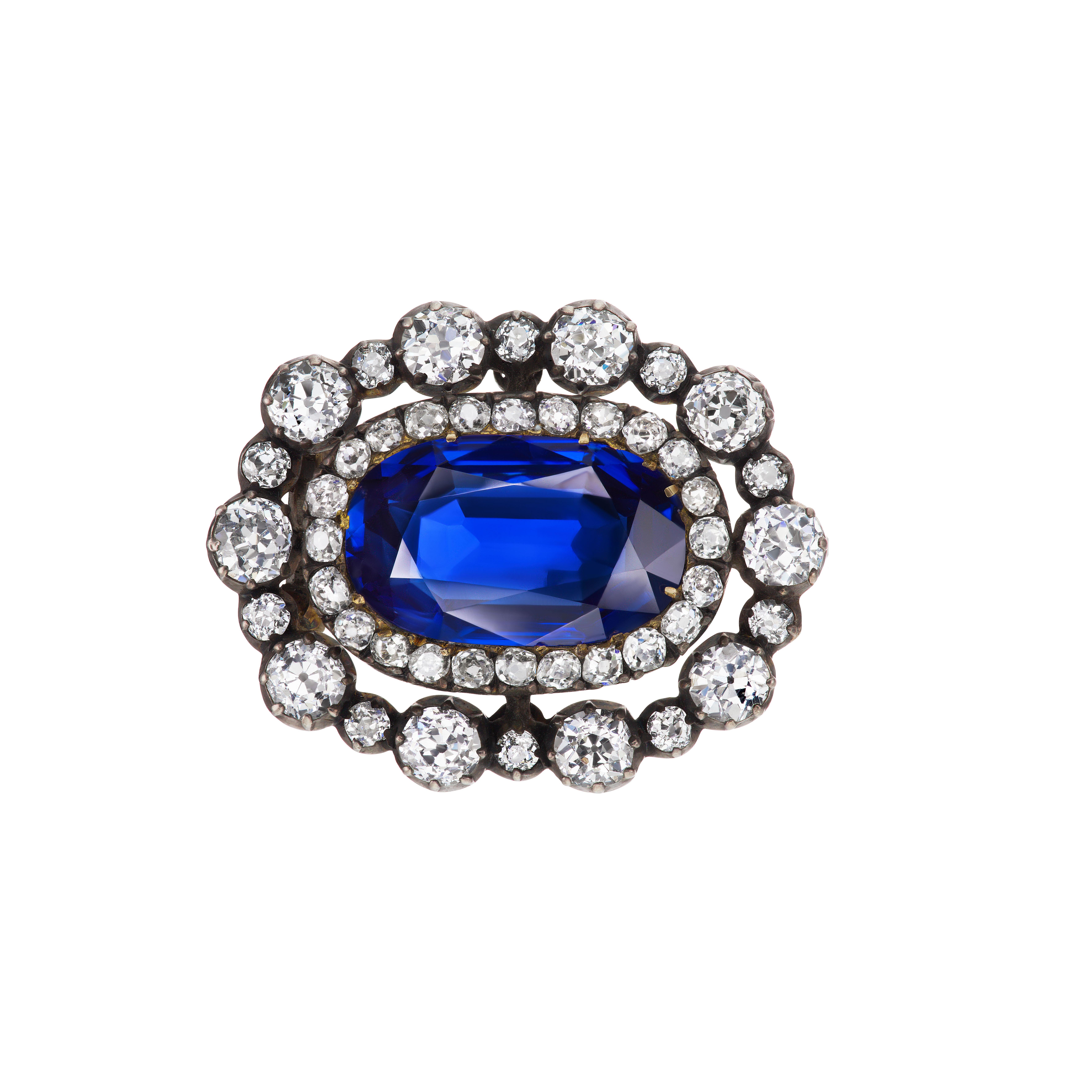 This charming Victorian era brooch is mounted with an exquisite oval Burma sapphire weighing approximately 8.20 carats surrounded by a double oval of antique european cut diamonds of superb color and clarity weighing approximately 5.55 carats. 

AGL