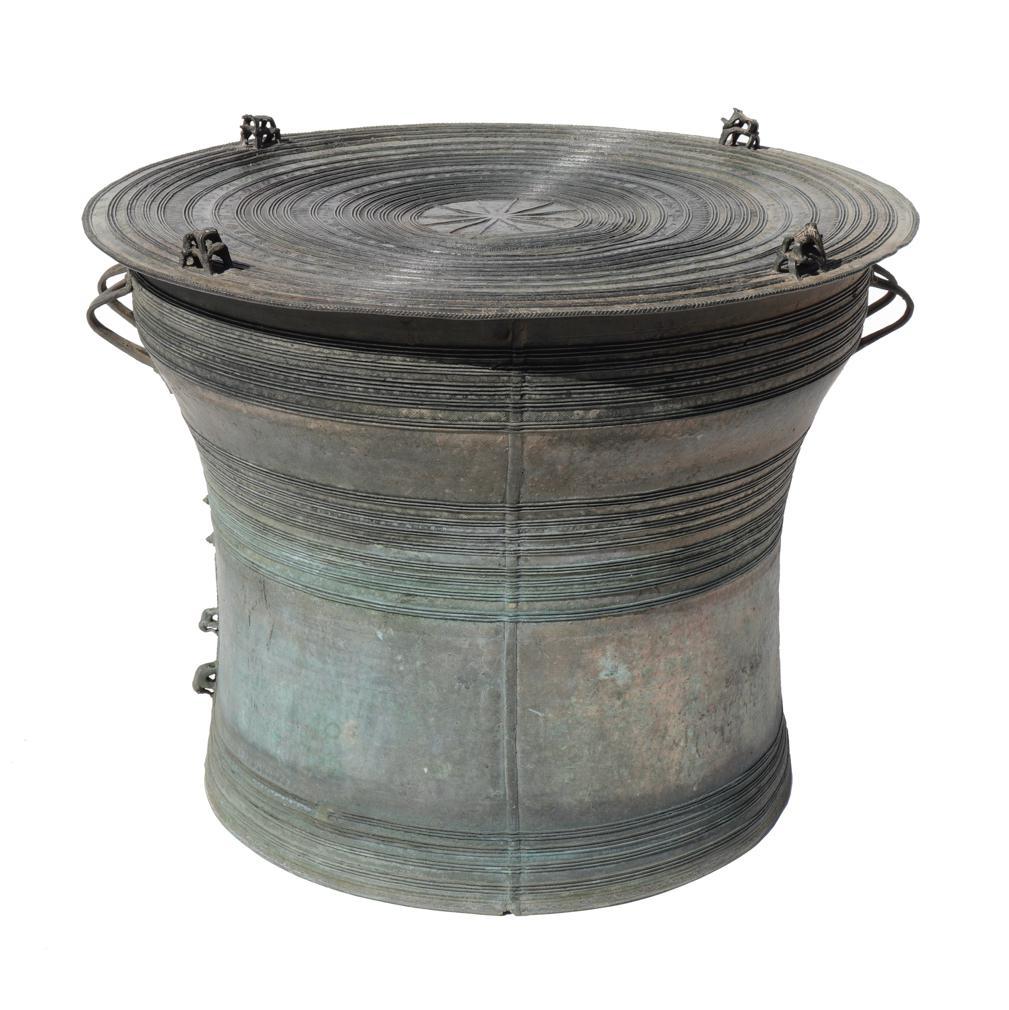A fine bronze tribute drum (Heger Type III), Pazi  (Burmese), pam klo’ (Karen). This unique lost wax casting of a drum is ornamented with 8 frogs with bulging eyes placed in stacks of two at four equidistant points near the edge of the tympanum, the