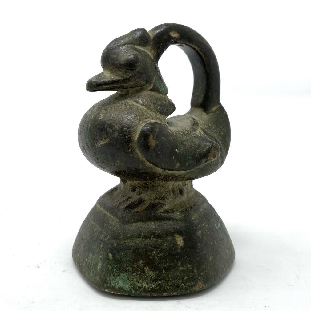 Antique Burmese A-le, a zoomorphic form bronze market weight often referred to as an “opium weight”, in the form  of a Hintha, a Brahmani Duck (Hamsa) emblem of the Mon kingdom with duck’s bill, crested comb, bulging eyes, and side wings standing on
