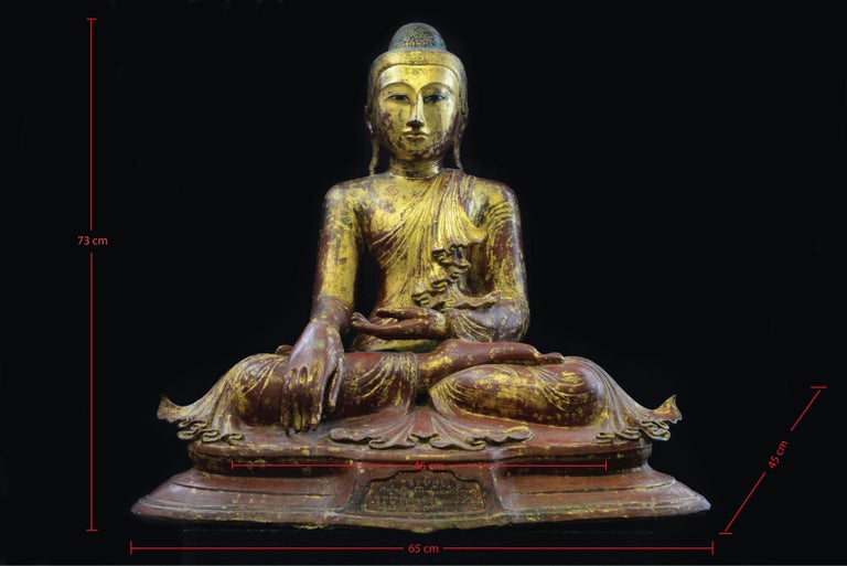 A fine early gilt lacquered bronze Buddha seated in the padmasana (lotus) position with bhumisparsha mudra. This mudra is depicted with the right hand placed over the knee and the fingertips pointing down towards the earth, to symbolize