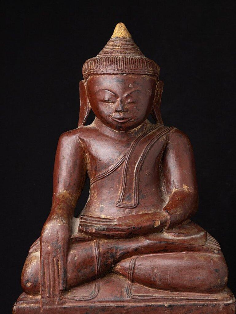 Material: wood
67 cm high 
46 cm wide and 25 cm deep
Weight: 13.15 kgs
With traces of 24 krt. gold
Ava style
Bhumisparsha mudra
Originating from Burma
18th century
Very low priced !
