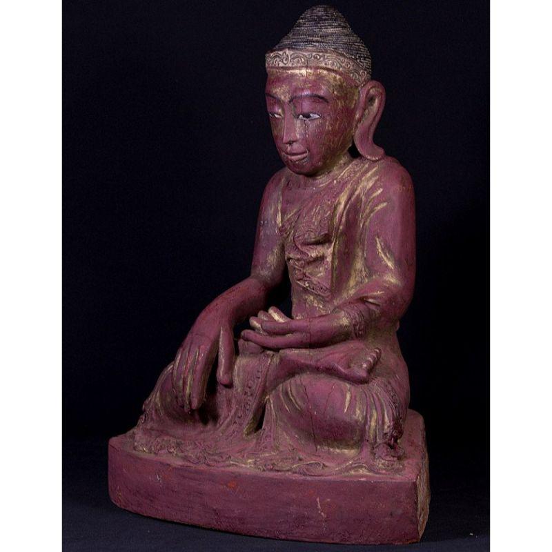 Material: wood
54,5 cm high 
42,5 cm wide and 28 cm deep
Weight: 10 kgs
With traces of the original 24 krt. gilding
Mandalay style
Bhumisparsha mudra
Originating from Burma
Early 20th century

 