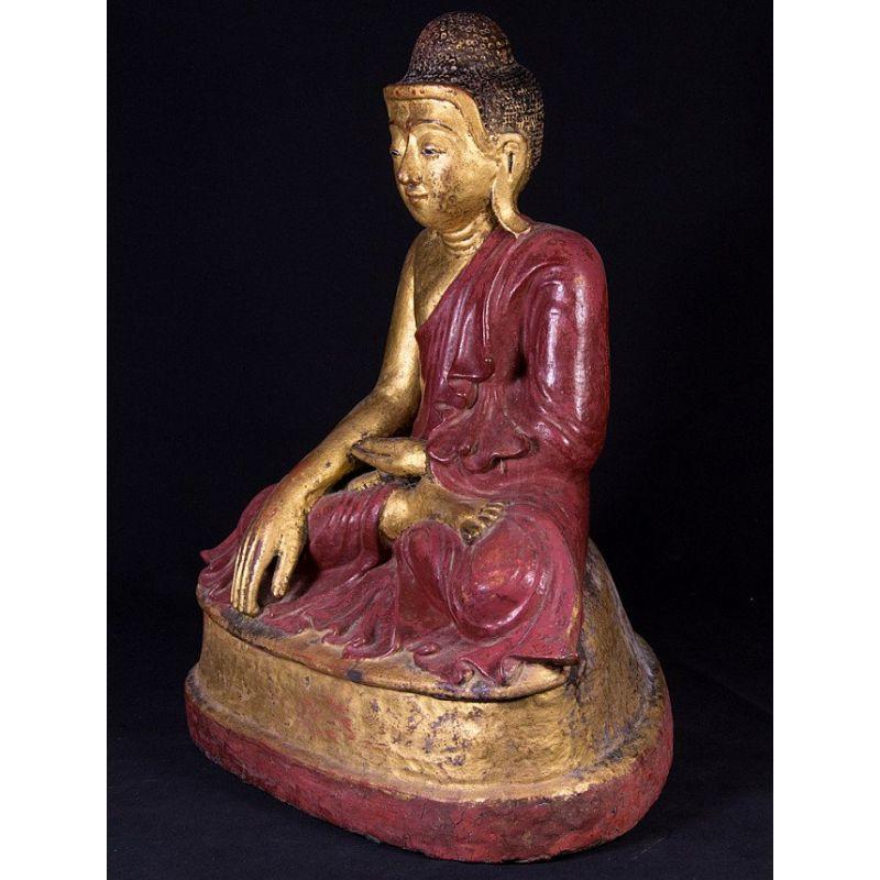 Material: lacquerware
52 cm high 
42 cm wide and 31 cm deep
Weight: 7.7 kgs
Gilded with 24 krt. gold
Mandalay style
Bhumisparsha mudra
Originating from Burma
19th century
With inlayed eyes
Made of lacquer (hollow inside).
 