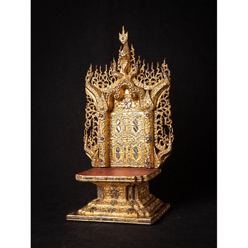 Material: wood
50,3 cm high 
26,8 cm wide and 18,5 cm deep
Weight: 1.884 kgs
Gilded with 24 krt. gold
Mandalay style
Originating from Burma
19th century

