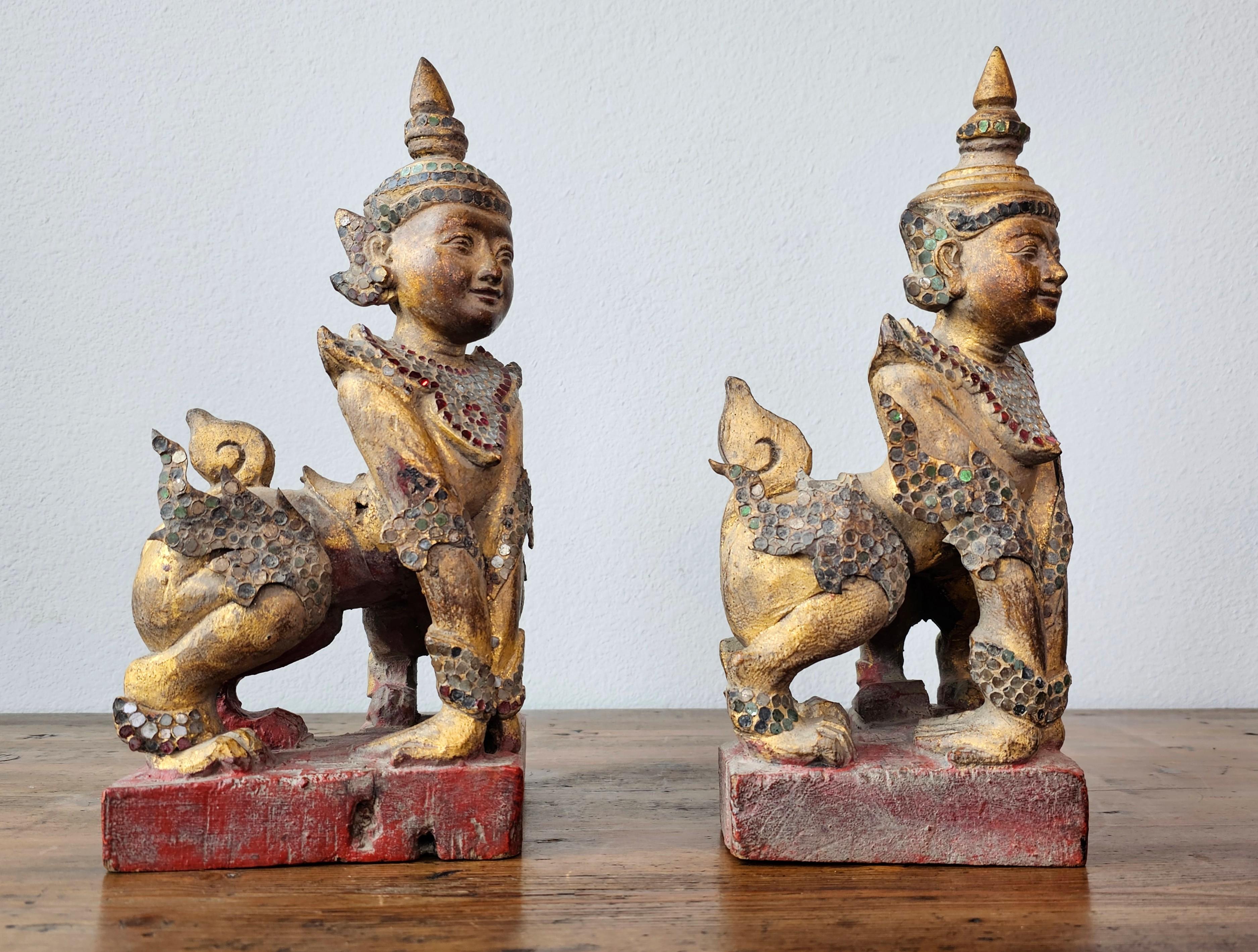 20th Century Antique Burmese Carved Gilt Wood Glass Jeweled Manussiha Figure Pair