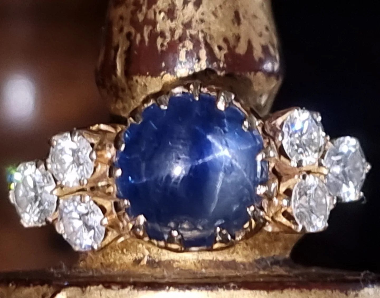 RARE BURMESE (Mogok - Myanmar) BLUE STAR SAPPHIRE AND DIAMOND RING, not heated, not treated.
Accompanied by Lotus Gemology Laboratory (Richard W. HUGHES) certificate no. 2940-9400, stating that the sapphire is of Burma origin, with no indications of