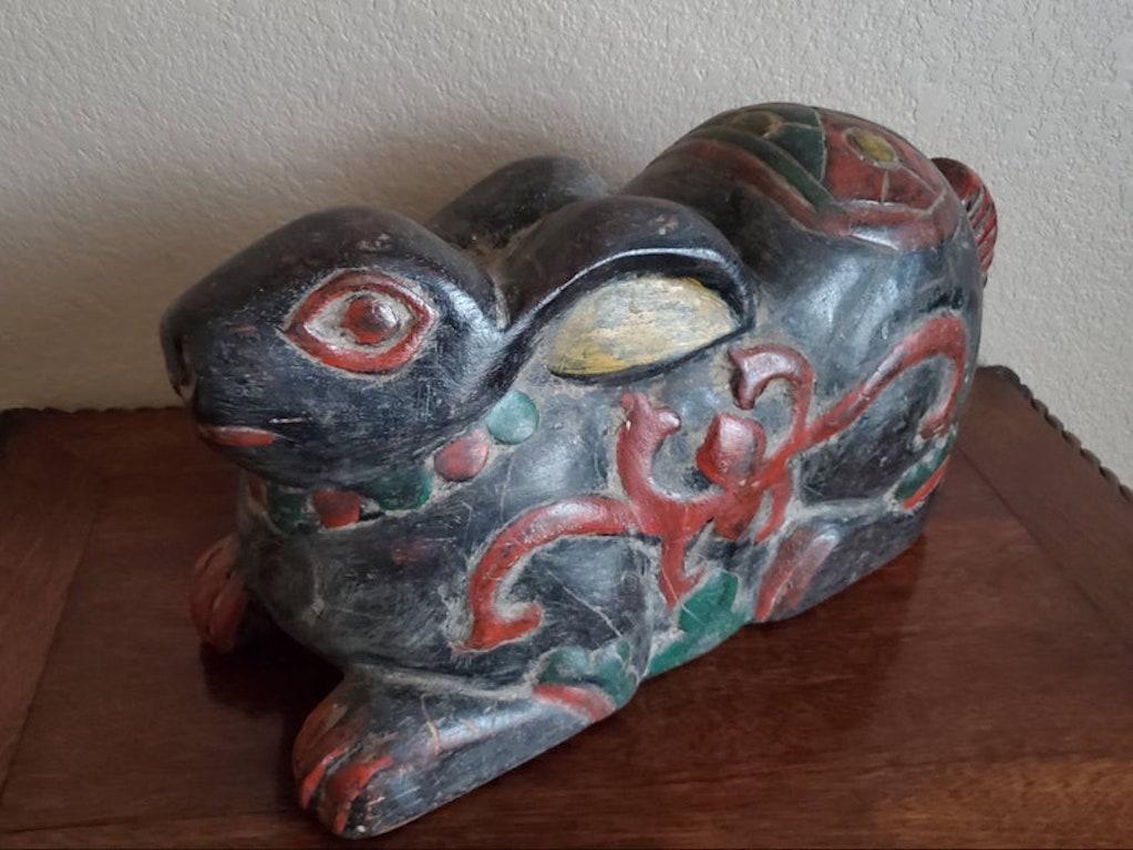 A large whimsical hand carved and painted antique Southeast Asian wooden hare sculpture with incised detailing, polychrome decoration and beautifully aged patina.

Hand-crafted in the early 20th century, most likely originally commissioned as an