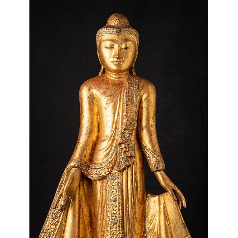 Material: wood
84 cm high 
39,5 cm wide and 22 cm deep
Weight: 7.05 kgs
Gilded with 24 krt. gold
Mandalay style
Originating from Burma
19th century
With inlayed eyes

