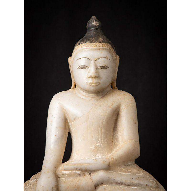 Material: marble
56,5 cm high 
31 cm wide and 18 cm deep
Weight: 20.85 kgs
Shan (Tai Yai) style
Bhumisparsha mudra
Originating from Burma
17th century.
 