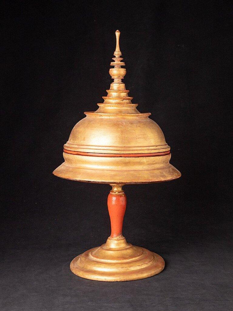 Material: wood
55,5 cm high 
29,7 cm diameter
Weight: 2.9 kgs
Gilded with 24 krt. gold
Originating from Burma
Late 19th century.
 