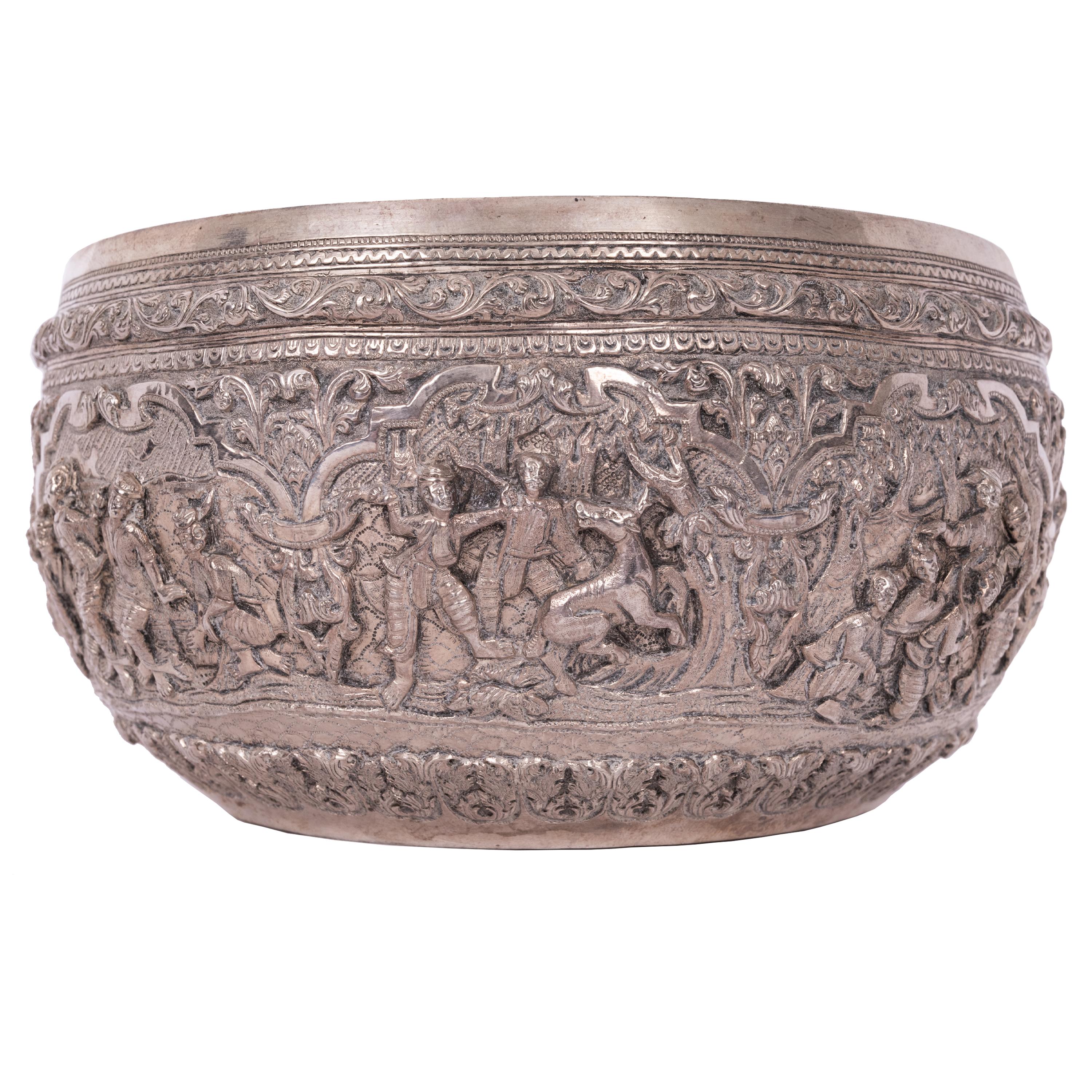 A very good Burmese (Myanmar) silver repousse work Thabeik offering bowl, circa 1890.
The bowl atributed to Maung Yin Maung, with an engraved guanyin figure to the base, pre-dating the 
