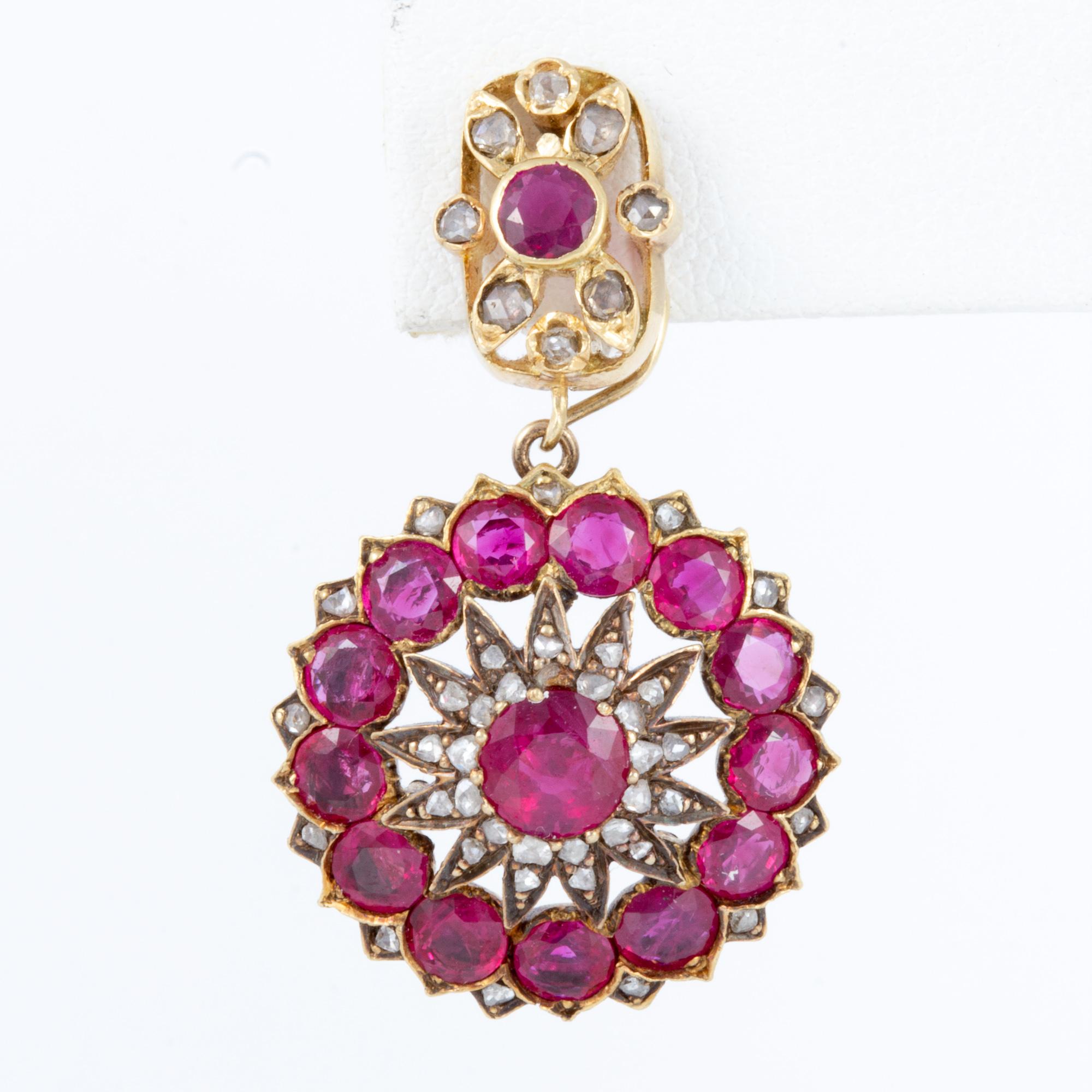 From the latter part of the 19th century, these are some of the happiest rubies we have come across.  Originally part of a necklace, both the top and the bottom sections of the earrings are of the period.  Modified by a master European certified