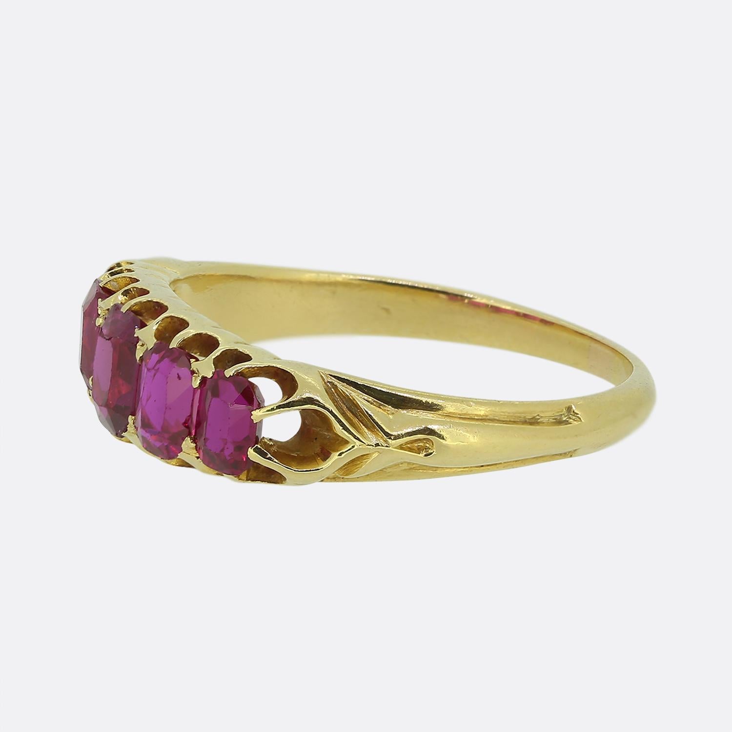 Here we have a gorgeous five-stone ruby ring. This antique piece has been crafted from a rich 18ct yellow gold and features five emerald-cut rubies of Burmese origin set across the face in a single line formation whilst graduating in size towards
