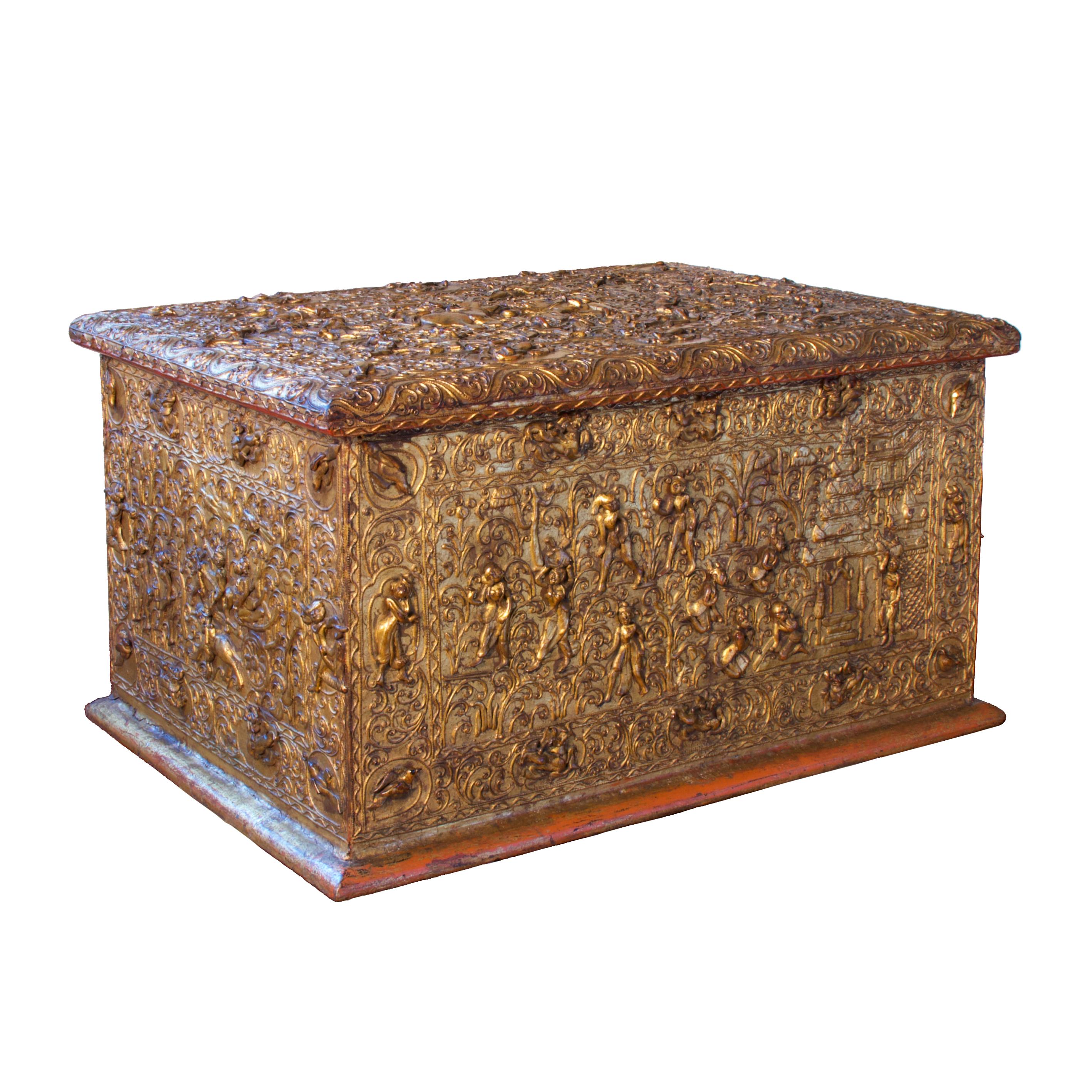 The chest is constructed of teak covered in lacquer and gold leaf with a hinged lid and detailed decoration on four sides. The high relief thayo lacquer depicts narrative scenes, bordered by a tendril vine frame with reserve cartouches of birds,