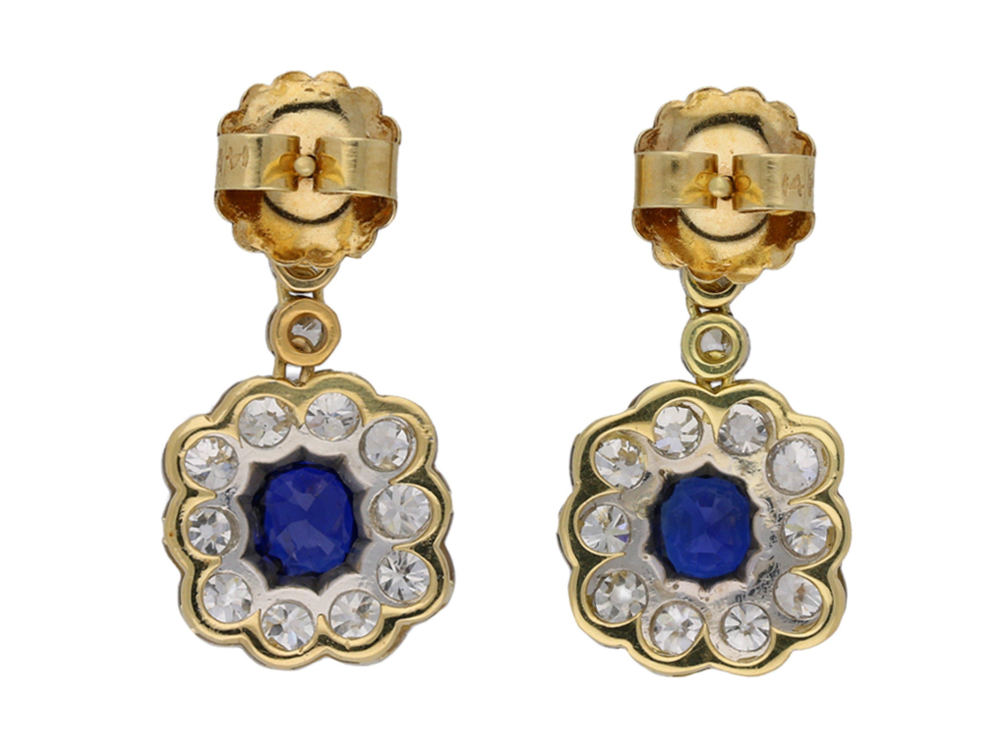 Antique Burmese sapphire and diamond earrings. A matching pair, each set to centre with a cushion shape old cut natural unenhanced Burmese sapphire in an open back claw setting, the two with a combined approximate weight of 2.50 carats, suspended