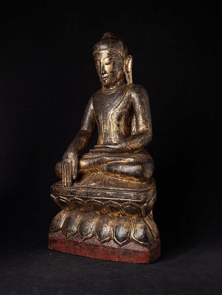 Material: wood
68,5 cm high 
35 cm wide and 22,3 cm deep
Weight: 11.7 kgs
With traces of 24 krt. gilding
Shan (Tai Yai) style
Bhumisparsha mudra
Originating from Burma
Early 18th century
Very nice quality !
 