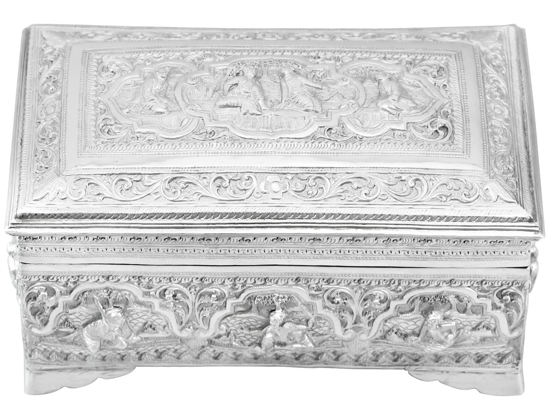 An exceptional, fine and impressive antique Burmese silver box; an addition to our diverse Asian silverware collection.

This exceptional antique Burmese silver box has a rectangular form, supported with plain bracket style feet.

The body of this