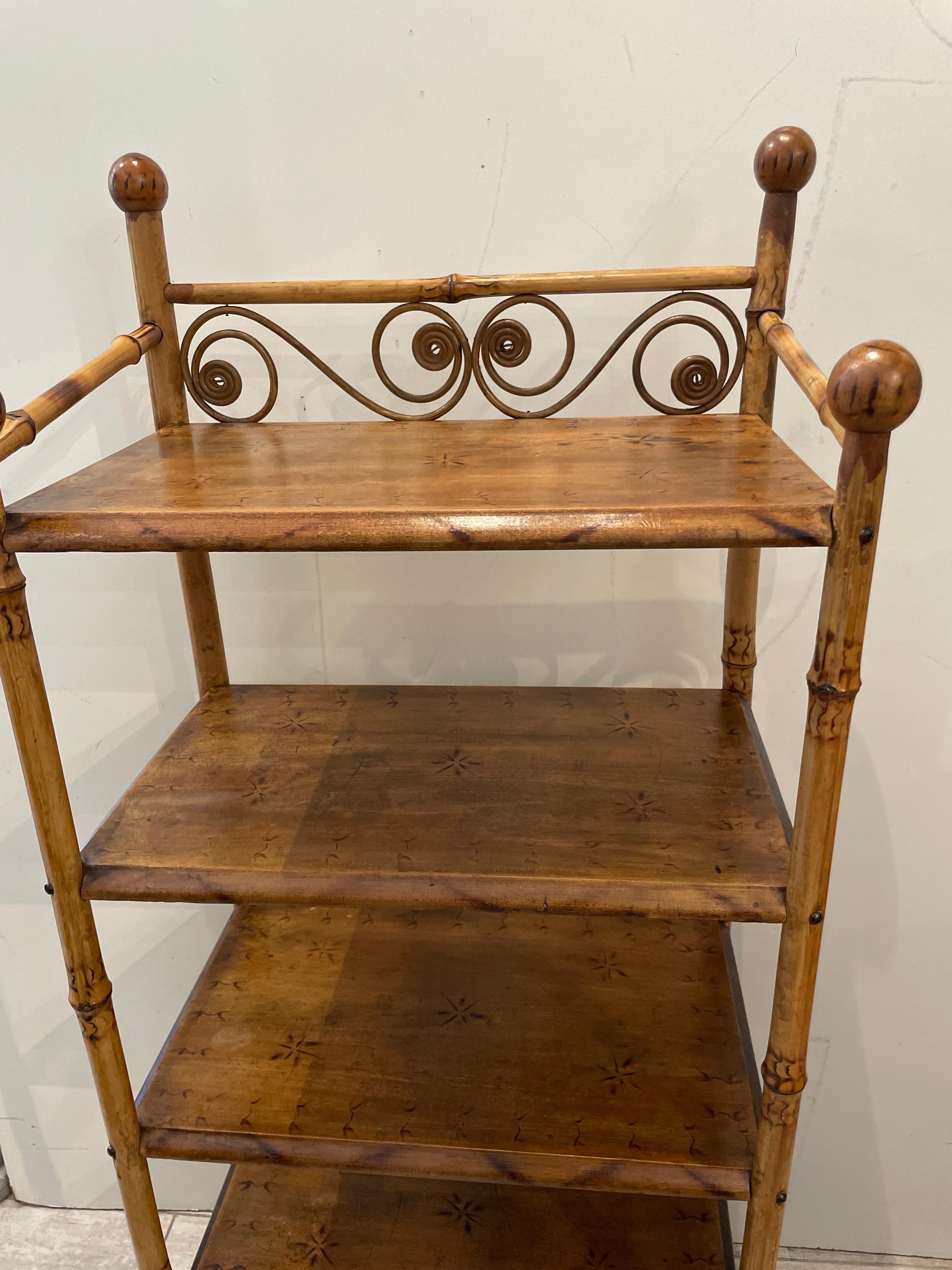 Antique burnt bamboo four shelf etagere. Scrolled detail on top shelf and four large ball finials at top.