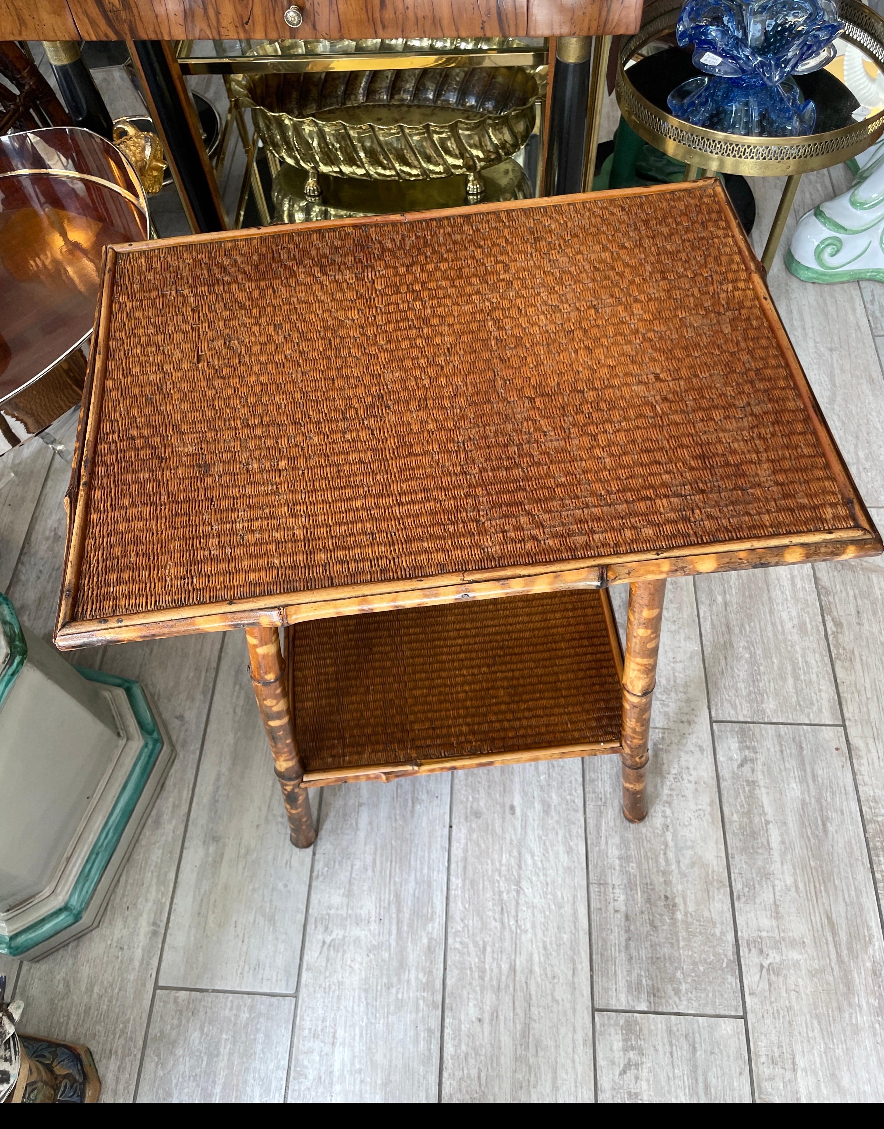 Wonderful antique burnt bamboo two tier side table in its original condition.