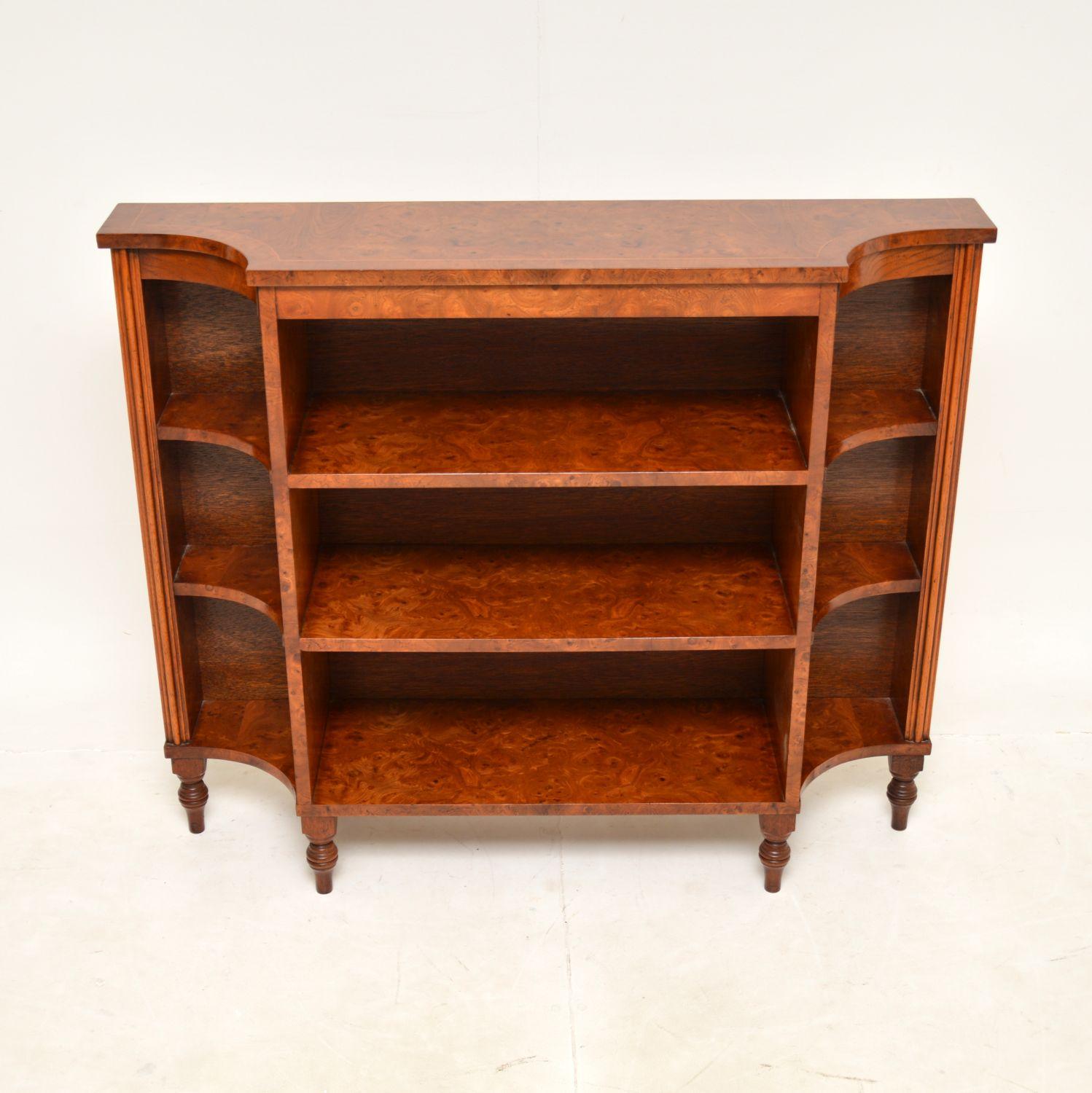 A very smart and stylish antique Regency style open bookcase in elm. This was made in England, it dates from around the 1950’s.

It is of superb quality and is a very useful item. The burr elm grain patterns are absolutely stunning, this sits on