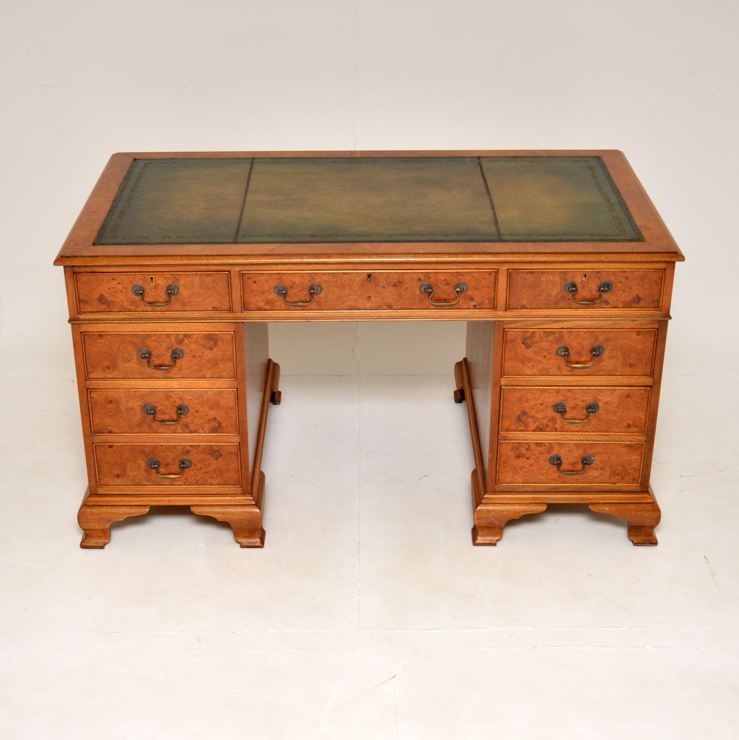 A stunning antique pedestal desk, beautifully finished in burr elm. This was made in England, it dates from around the 1950’s.

The quality is amazing, this is a very well made and useful item. The burr elm has a gorgeous, light colour tone and
