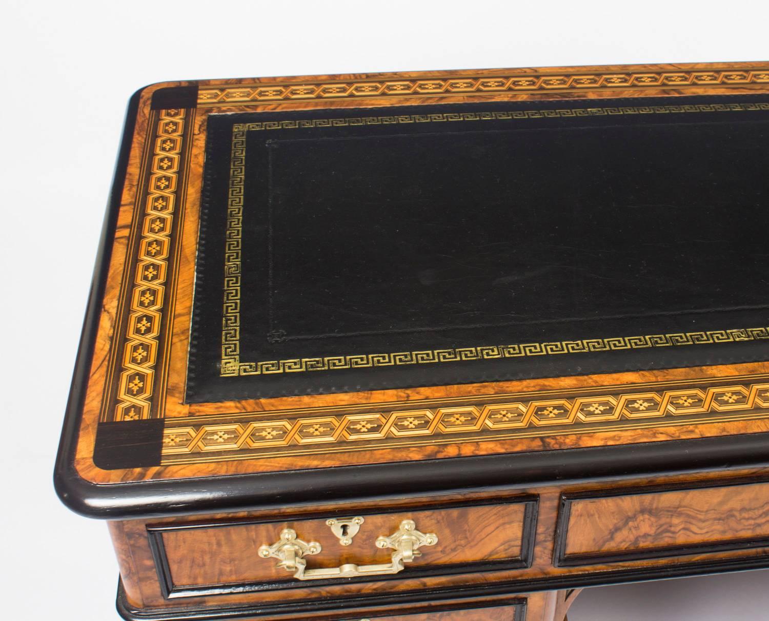 This is a superb antique Victorian burr walnut and ebonised twin pedestal desk, circa 1870 in date.

It is made from fabulous burr walnut, the rounded rectangular top with a fabulous inset gold tooled black leather writing surface, it features an