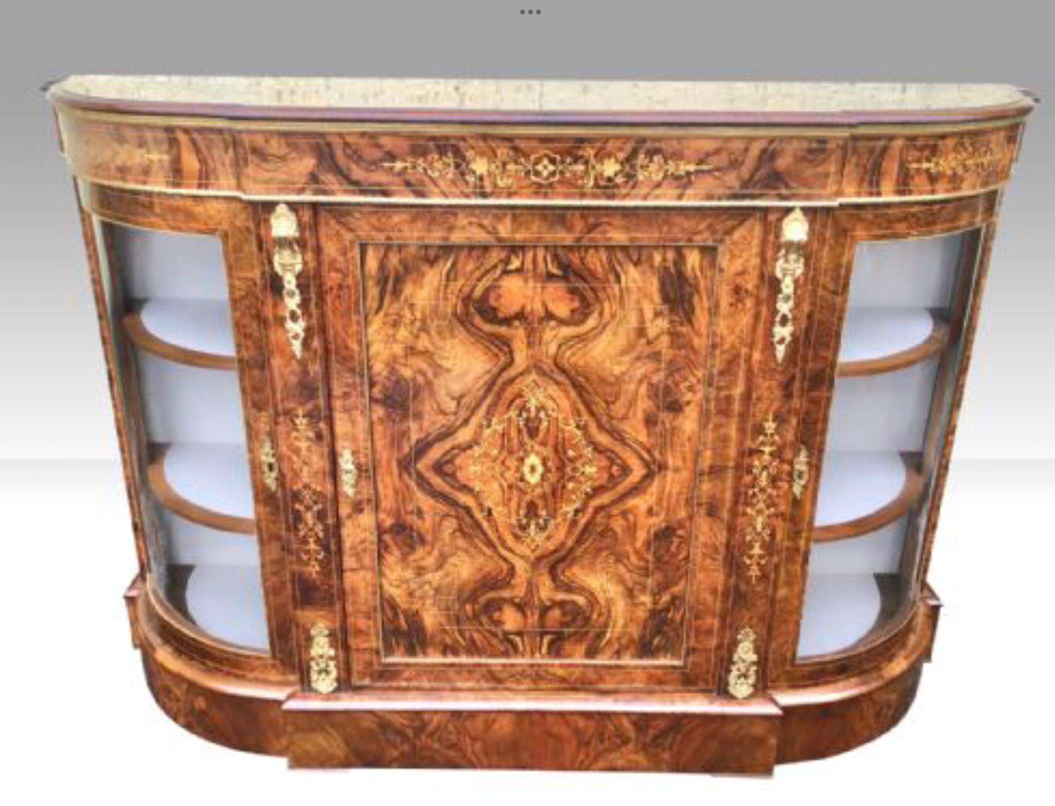 A stunning exhibition quality Victorian figured and burr walnut and gilt ormolu mounted antique credenza cabinet sideboard with central hinged door flanked by glazed bowed shape glazed ends all opening to reveal shelved storage and display area