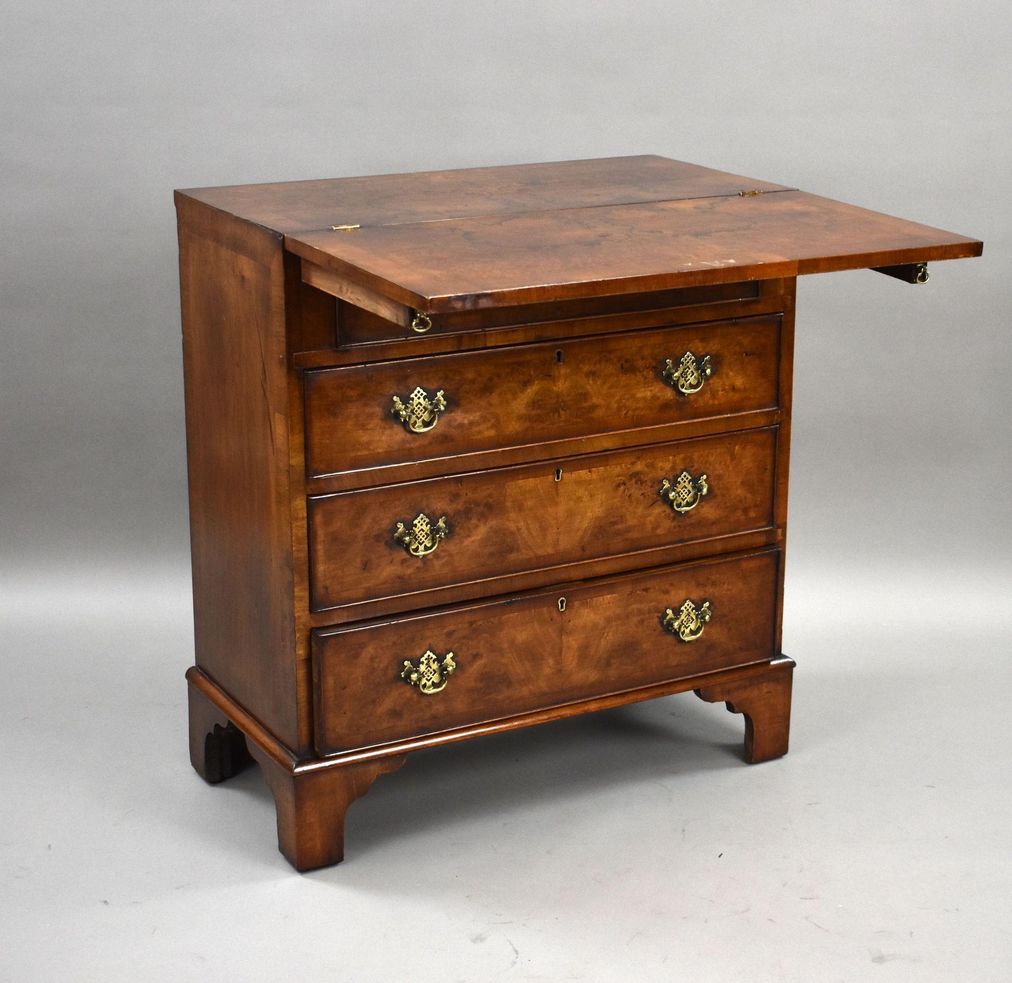 Antique Burr Walnut Bachelor’s Chest with Fold-Over Top
Item Code: S27-1081
A charming antique burr walnut bachelor’s chest, featuring a fold-over top that opens to form a practical writing or dressing surface. The chest is fitted with four