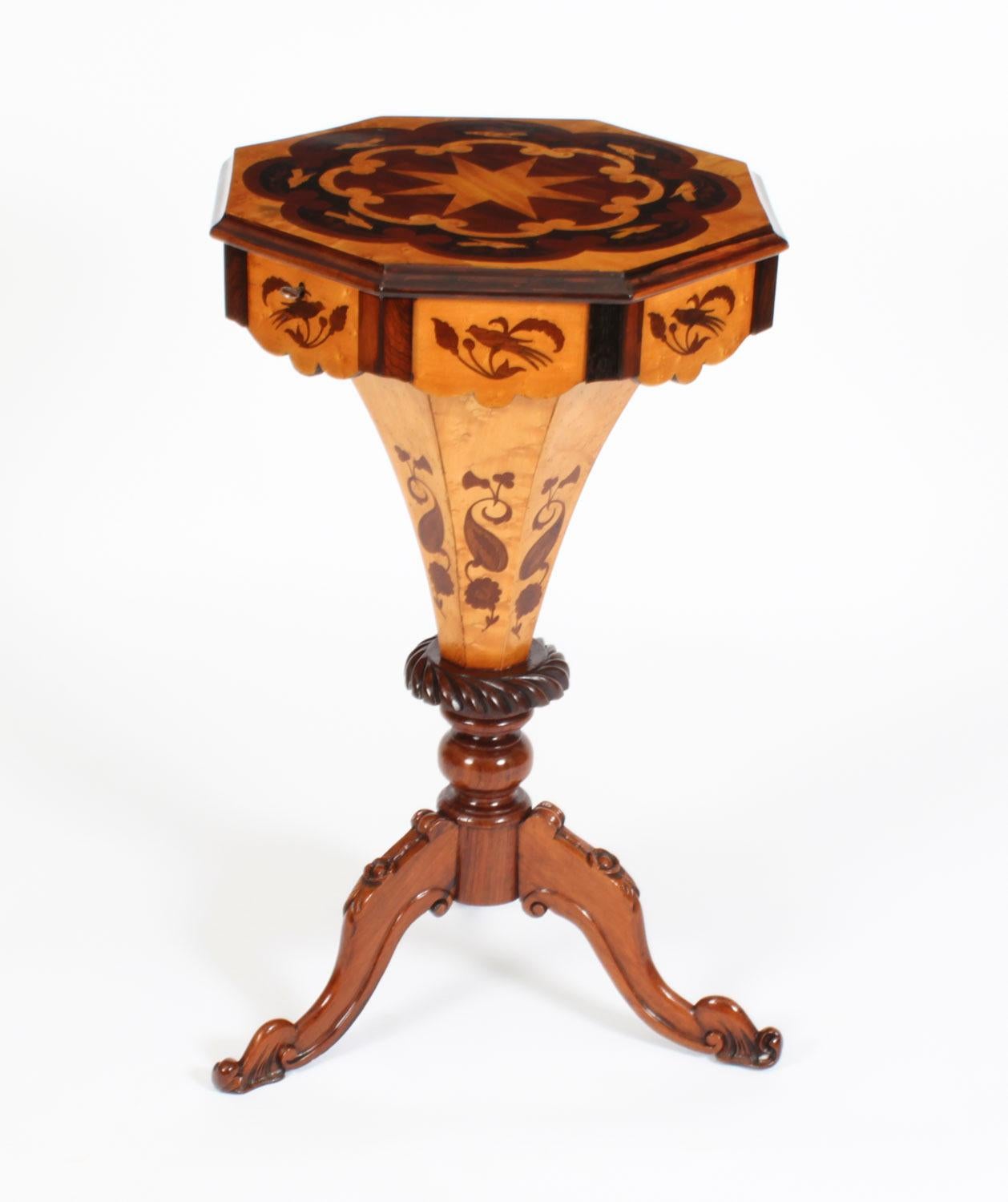 A superb burr walnut and birdseye maple marquetry work / sewing table, Circa 1860 in date

The ornately floral marquetry inlaid octagonal hinged top with a central star motif within borders of confronting scrollwork and birds, the cover underside
