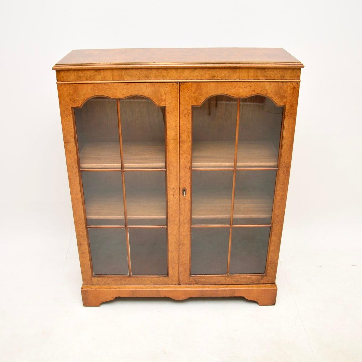 A smart and very well made antique burr walnut bookcase. This was made in England, it dates from around the 1930’s.

The quality is superb, this has stunning burr walnut grain patterns and a gorgeous mellow colour tone. The astral glazed glass