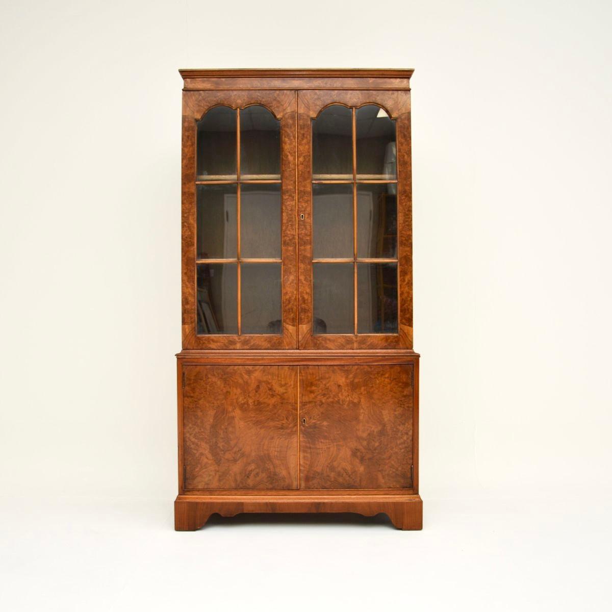 A lovely antique burr walnut bookcase in the Georgian style. This was made in England, it dates from around the 1930’s.

It is of very good quality and has lovely proportions, with lots of storage space. This has stunning burr walnut grain patterns