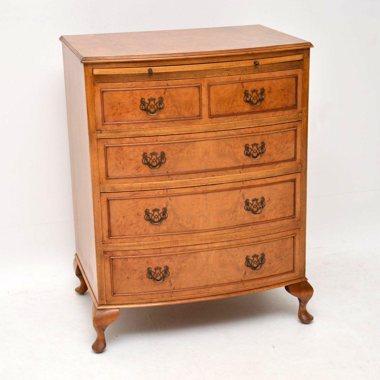 Small antique burr walnut bow fronted chest of drawer on Queen Anne feet and with a brushing slide at the top. It’s a lovely pale color and is in excellent condition, having just been French polished. The top and drawer fronts are burr walnut and
