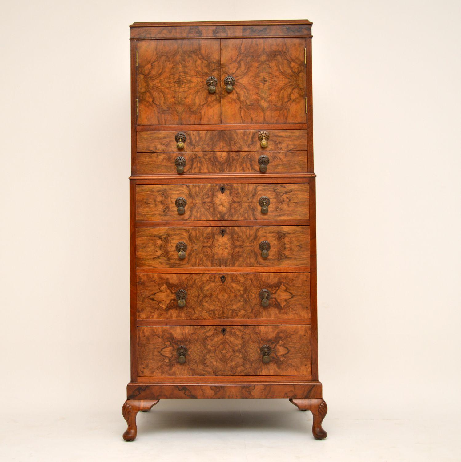 This antique walnut cabinet on chest is a really nice compact piece of furniture and has a terrific burr walnut grain pattern running all down the front section. Please enlarge all the images to appreciate the fine details. There is a small cupboard