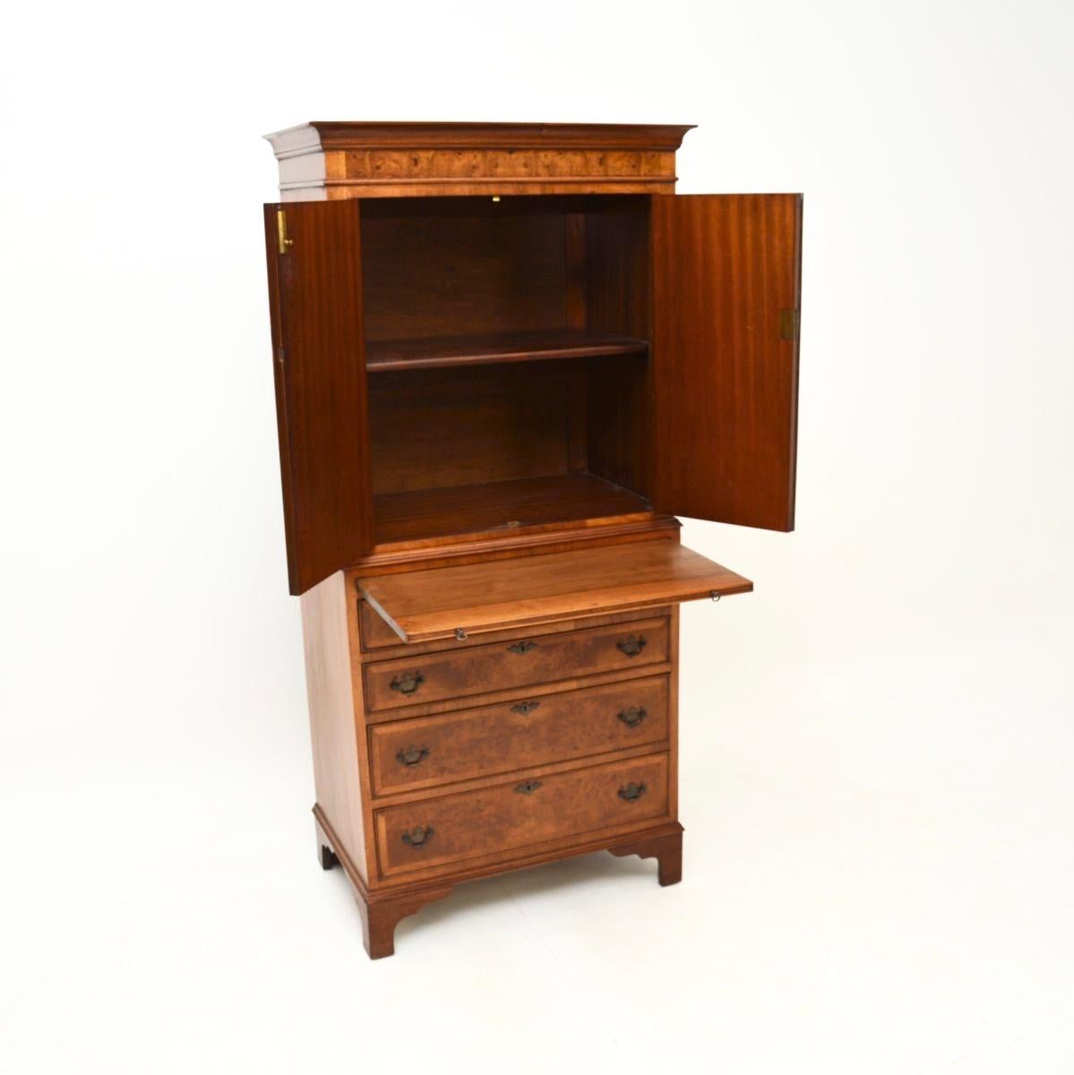 A lovely antique burr walnut cabinet on chest. This was made in England, it dates from around the 1920-30’s period.

It is of excellent quality, with stunning burr walnut grain patterns and lots of storage space. The upper compartment contains a