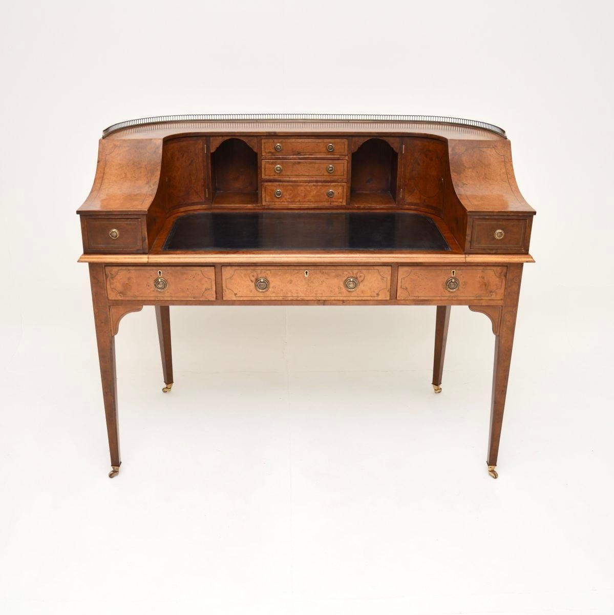 A superb antique burr walnut Carlton House desk, made in England and dating from around the 1890-1910 period.

This is of outstanding quality with many lovely features. It is a great size, with lots of storage space in the curved upper section and