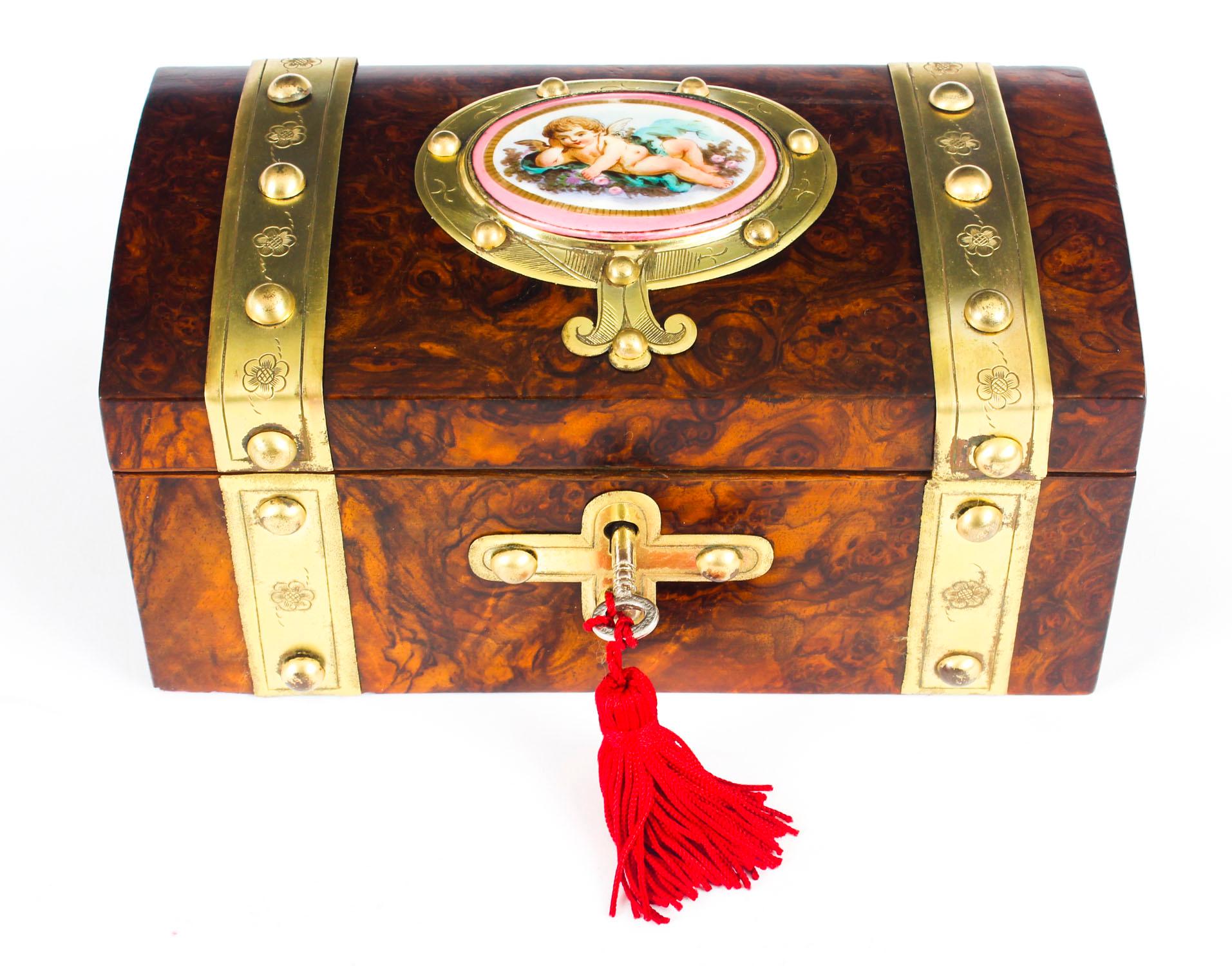 A 19th century porcelain and gilt brass mounted burr walnut box, hinged cover applied with an oval plaque, decorated with Cupid reclining, 21cm wide, circa 1870

This is a fine antique French 19th century porcelain and ormolu mounted burr walnut