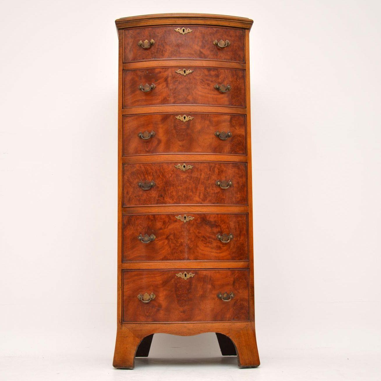 This tall slim antique burr walnut bow fronted chest of drawers has a wonderful color and beautiful grain patterns running through all the drawers. It’s very good quality and in excellent condition. The top is burr walnut with a figured walnut