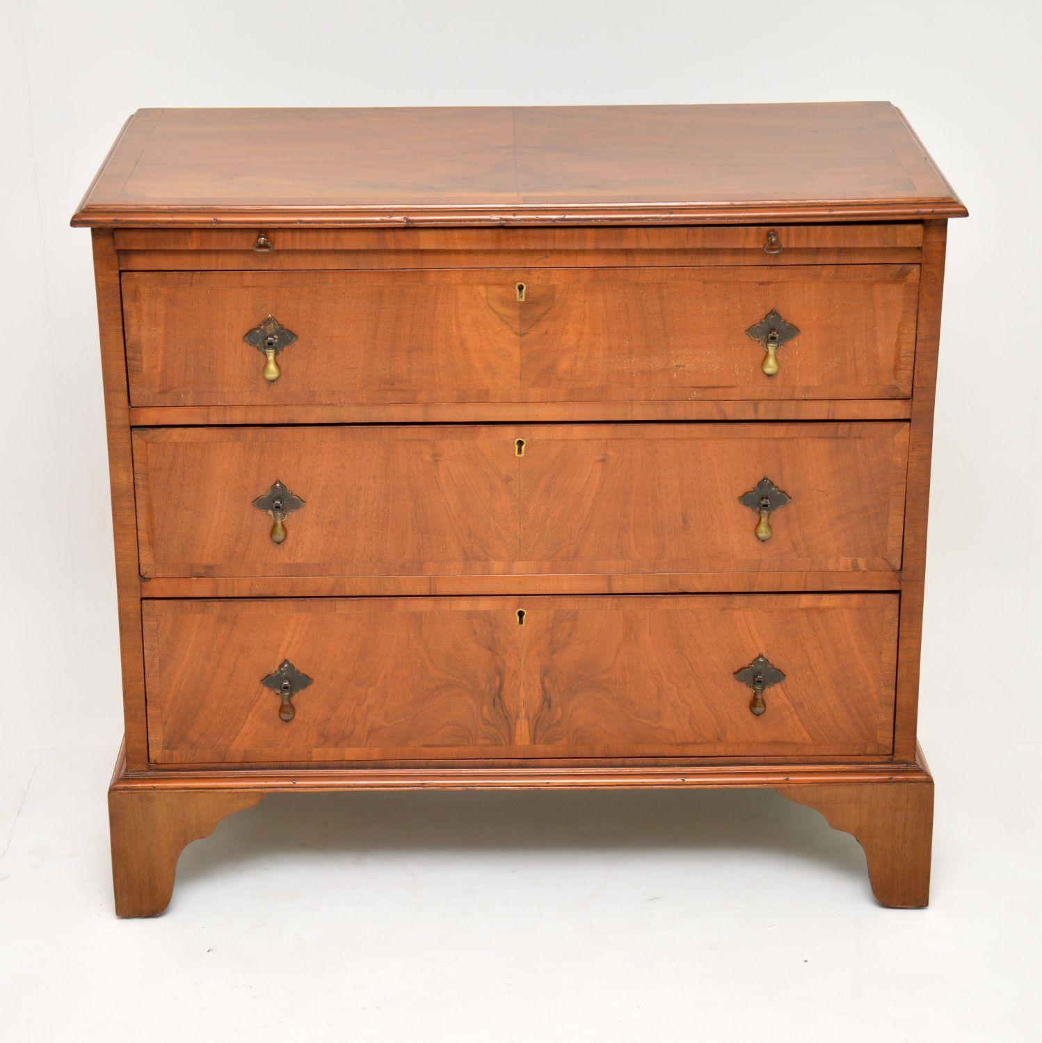 Antique burr walnut chest of drawers with a brushing slide and sitting on bracket feet, dating to circa 1910 period. It’s fine quality and has a wonderful original mellow color. The top is cross banded as are the drawers, which have original brass