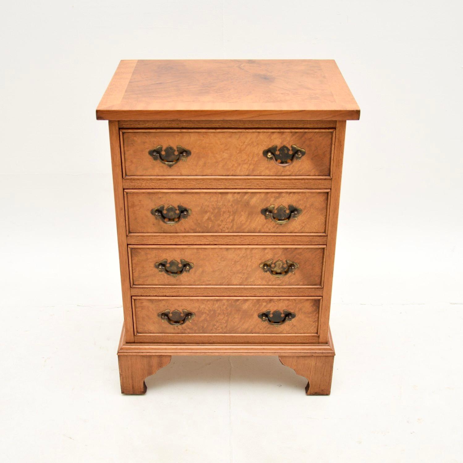 A beautiful little antique burr walnut chest of drawers in the Georgian style. This was made in England, it dates from around the 1950’s.

The quality is superb, this is of lovely proportions and has plenty of storage space. It sits on bracket feet,