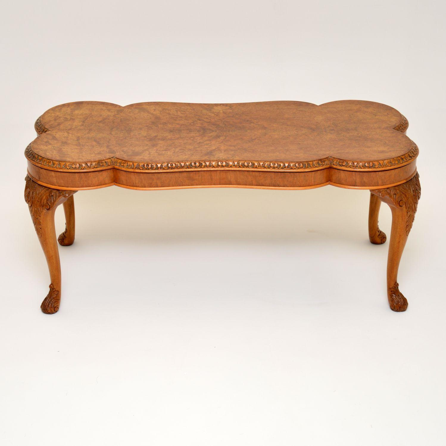 This antique walnut coffee table has a beautifully shaped and patterned burr walnut top with a carved edge. It’s in excellent condition having just been French polished to a high standard and dates to circa 1930s period. The legs are sold walnut and