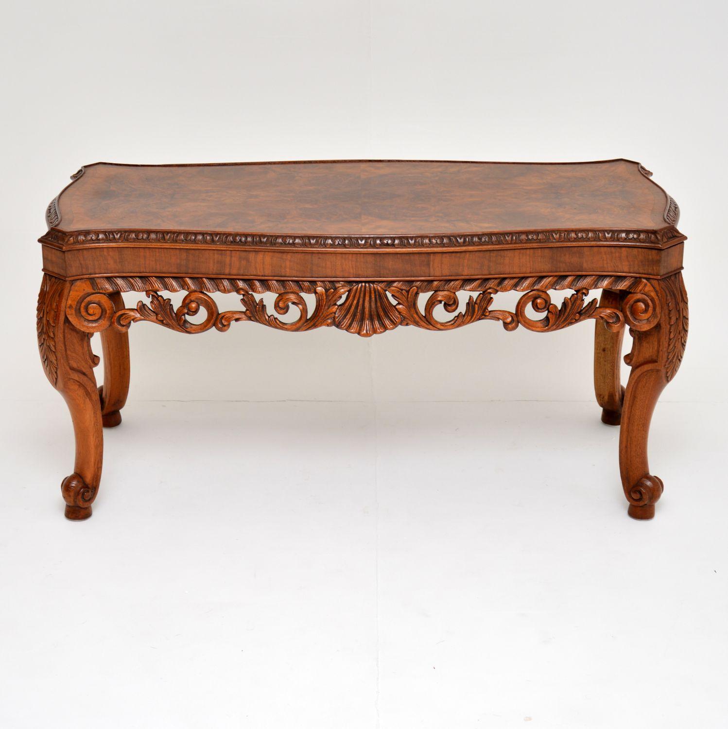 Fabulous quality antique Carolean style walnut coffee table with wonderful carved decorations.

The top surface is a well patterned burr walnut with a figured walnut crossbanded edge that’s carved outside. The rest of the carving is stunning &