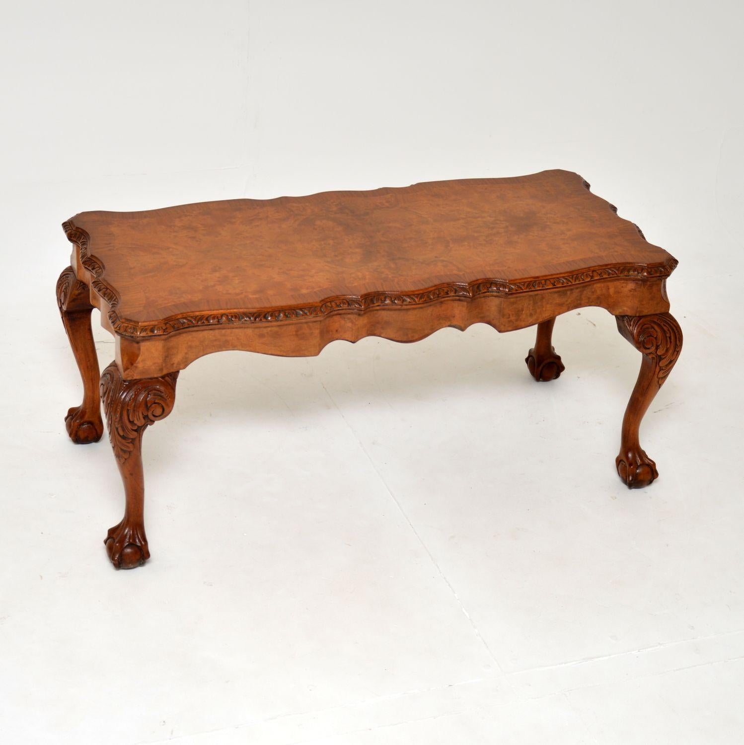 A stunning antique coffee table in burr walnut. This was made in England, it dates from the 1930’s.

It is of superb quality, with beautifully shaped and carved serpentine edges. The top has gorgeous burr walnut grain patterns with cross banded
