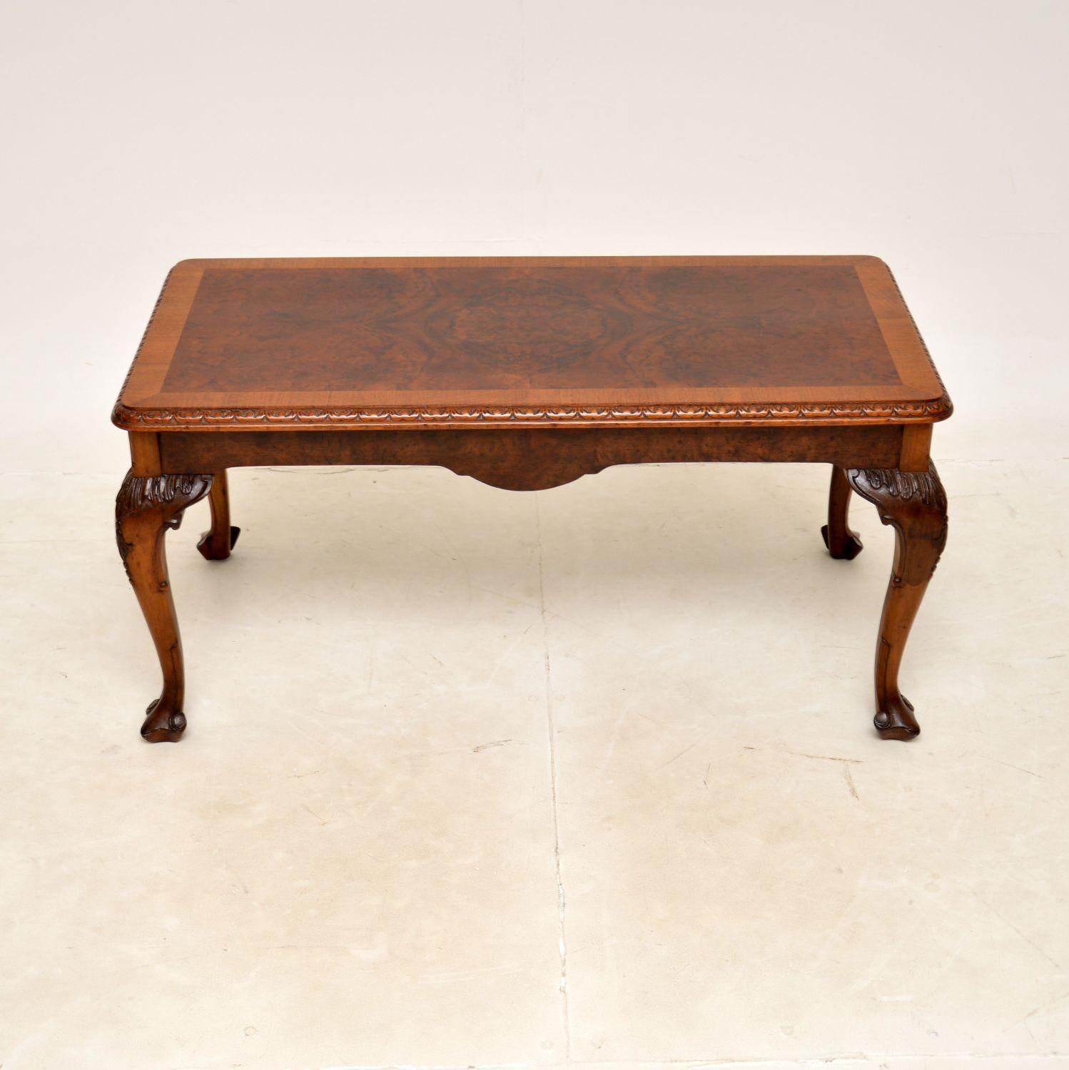 A beautiful antique walnut coffee table in the Queen Anne style. This was made in England, it dates from around the 1920-30’s.

The quality is superb, this has stunning burr walnut grain patterns on the top and side edges. The top is cross banded,
