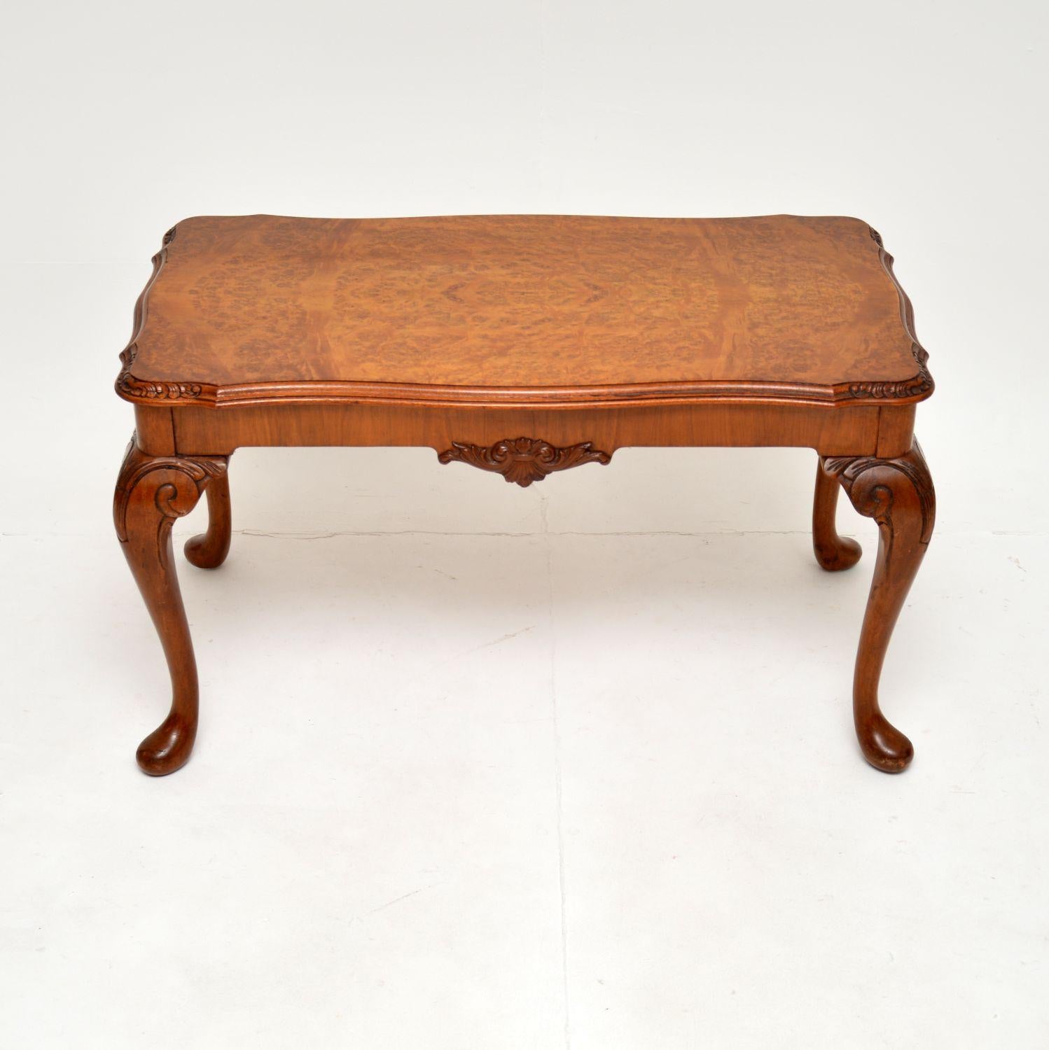 A lovely antique burr walnut coffee table in the Queen Anne style. This was made in England, it dates from around the 1930’s.

The quality is superb and this is a lovely, petite size. The edges are serpentine shaped and this sits on cabriole legs,