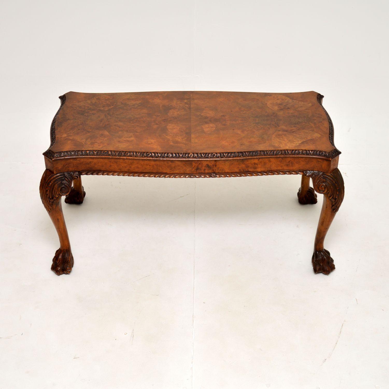 A gorgeous antique burr walnut coffee table in the Queen Anne style. This was made in England, it dates from the 1930’s.

It is of exceptional quality, the serpentine shaped top has a beautifully carved upper and lower edges. The cabriole legs have