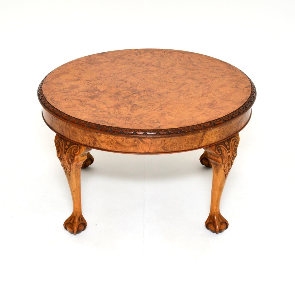 A quite large and beautifully made antique burr walnut coffee table. This was made in England, it dates from around the 1920-30’s.

The quality is outstanding, the circular top has fine and intricate carving around the edges, and has stunning burr