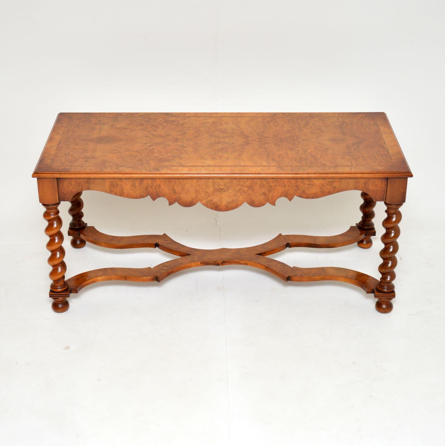 A large, beautiful and impressive antique William & Mary style coffee table in burr walnut. This was made in England, it dates from around the 1950’s.

The quality is amazing, with gorgeous barley twist legs and a beautifully shaped stretchered