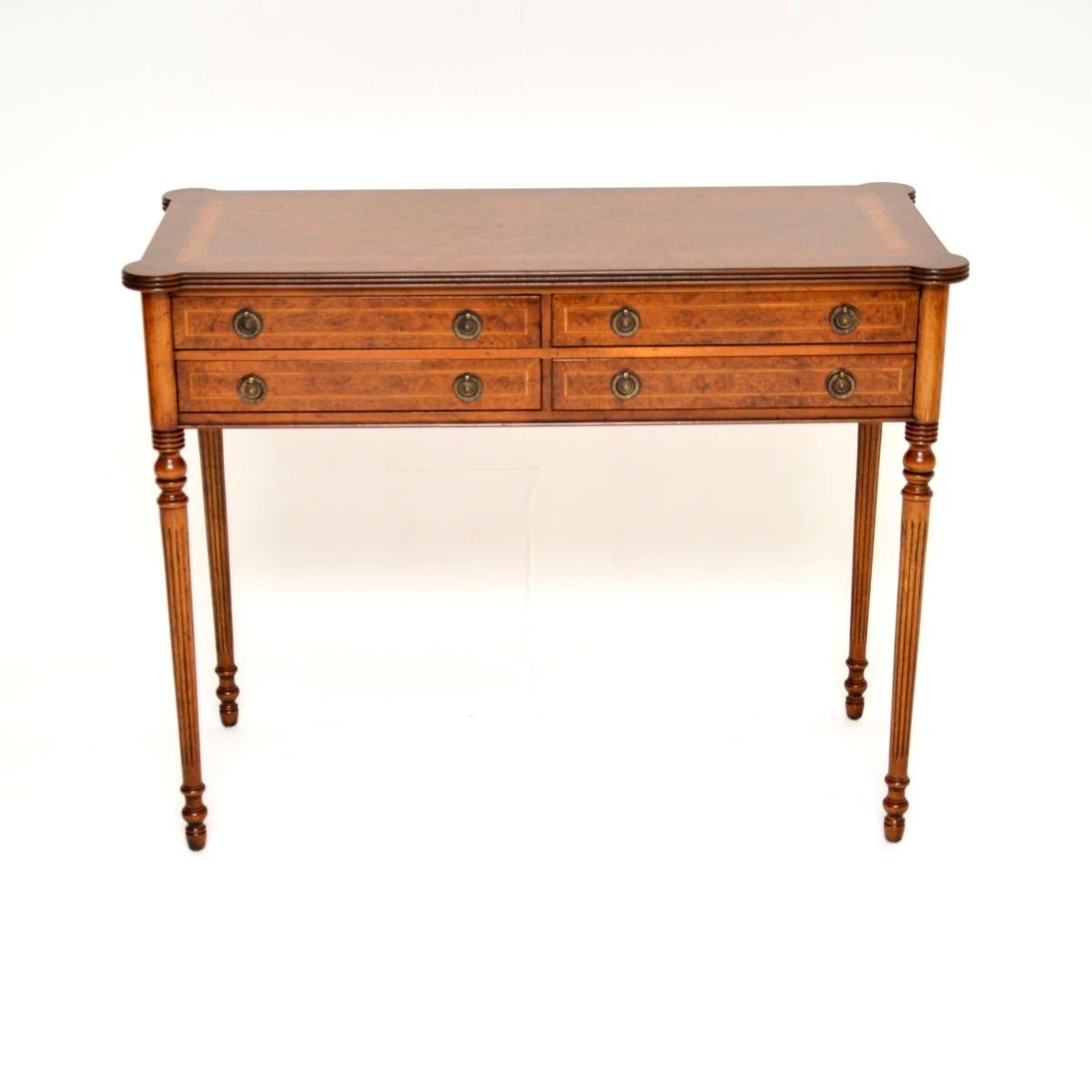 A superb antique burr walnut console / side table in the Georgian style. This was made in England, it dates from around the 1950’s.

The quality is outstanding, this has a beautiful design and it is a very useful size. There are four drawers with