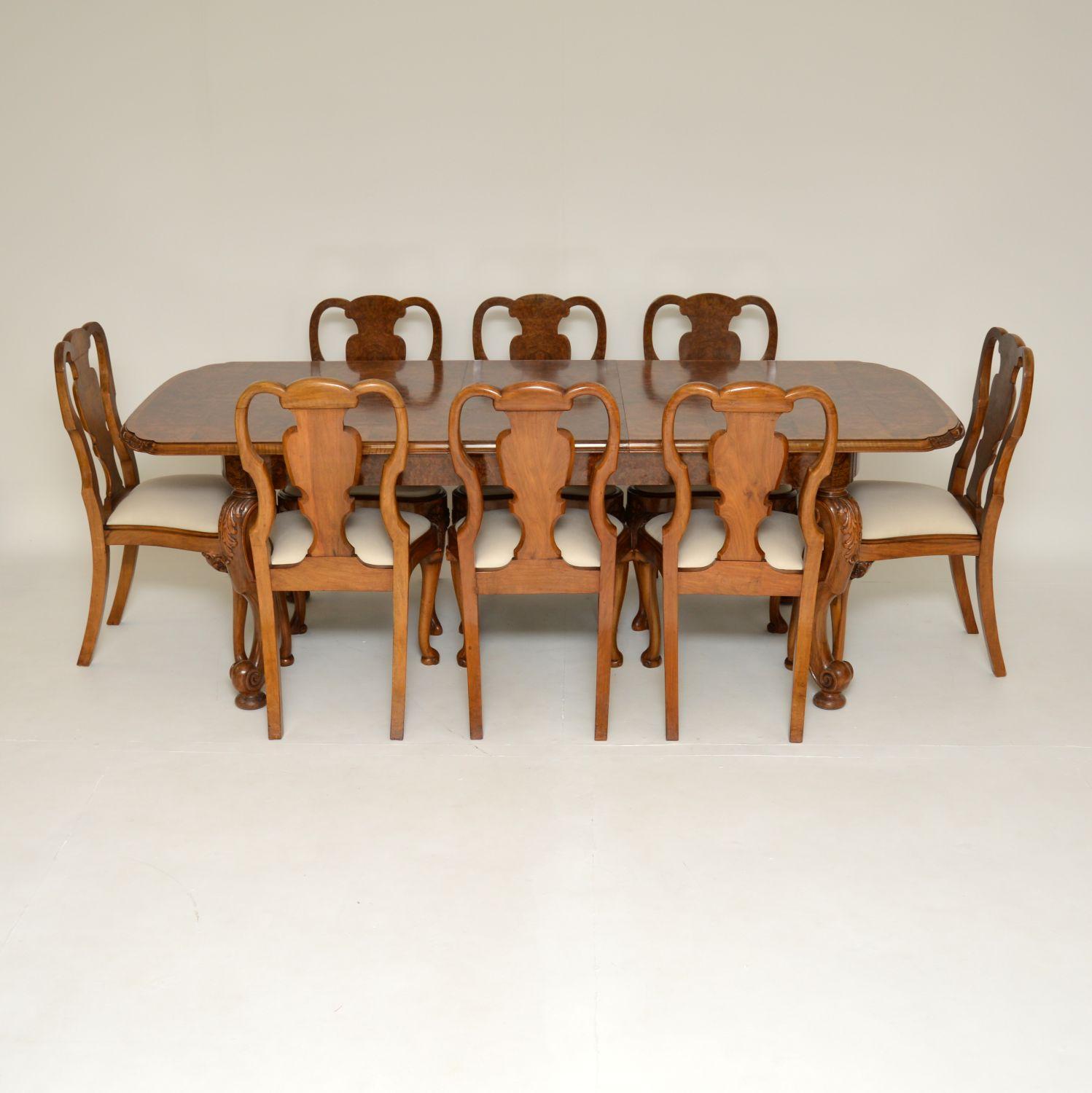 A superb antique extending dining table and matching set of eight chairs in walnut. This is in the Queen Anne style, it dates from around the 1920-1930’s.

The quality is absolutely superb, this is exquisitely designed and executed. The dining